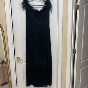 Maxi formal dress. Has a slit. Feather on top.